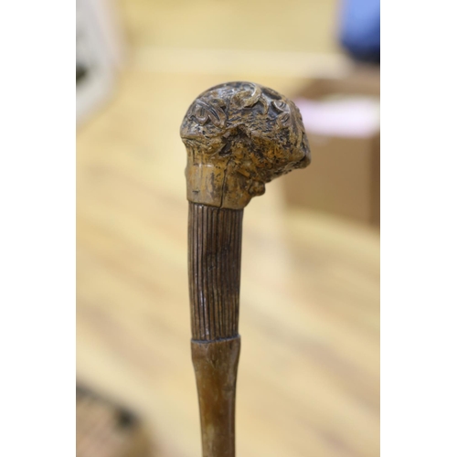 435 - A 19th century folk art walking stick, 89 cms long.