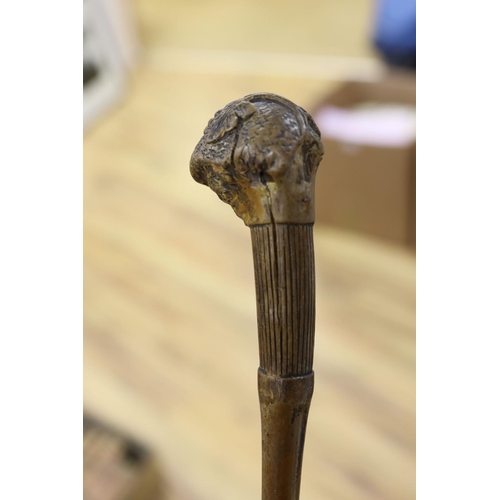 435 - A 19th century folk art walking stick, 89 cms long.