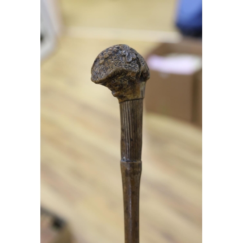 435 - A 19th century folk art walking stick, 89 cms long.