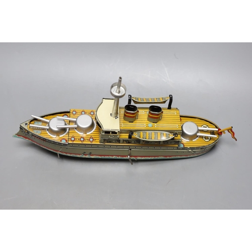 437 - Three IBA tinplate boxed toys, two boats and a train,largest boat 42 cms wide.