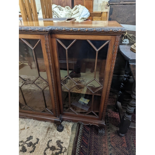 45 - A 1920's Chippendale revival glazed mahogany break front dwarf cabinet, width 160cm, depth 43m, heig... 