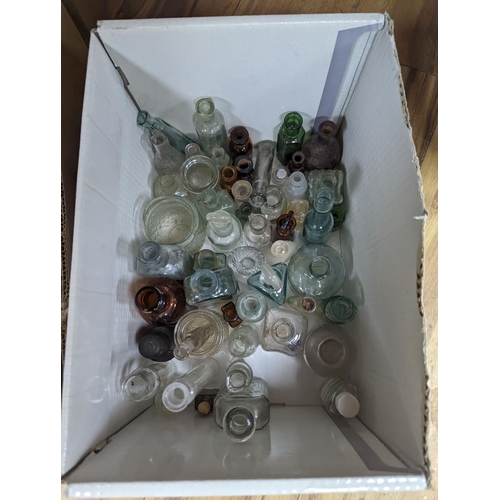 450 - A large collection of antique glass bottles and jars