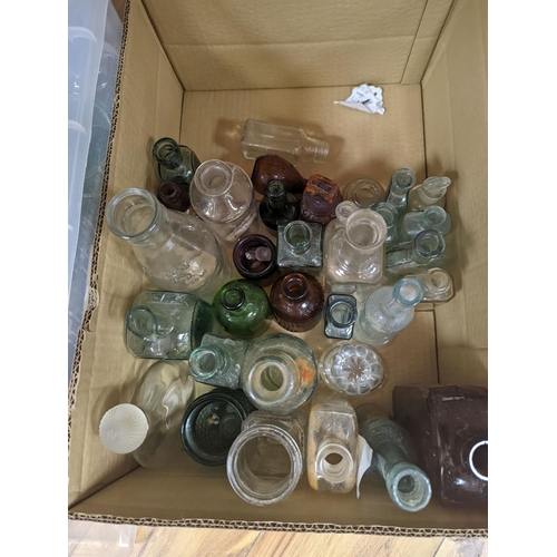 450 - A large collection of antique glass bottles and jars