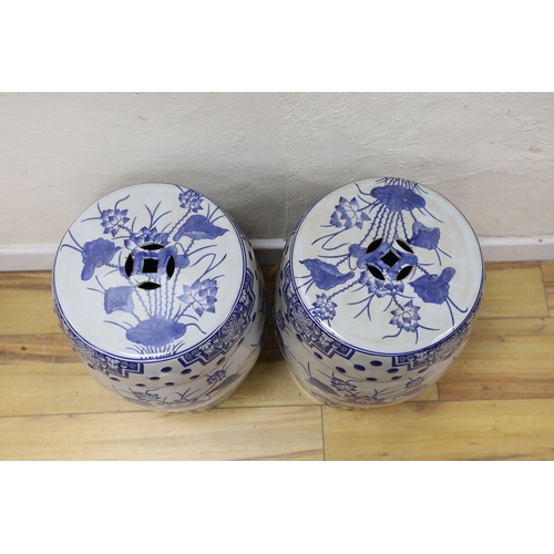 463 - A pair of Chinese blue and white garden seats, 44 cms high.