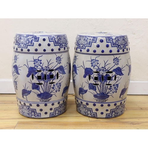 463 - A pair of Chinese blue and white garden seats, 44 cms high.