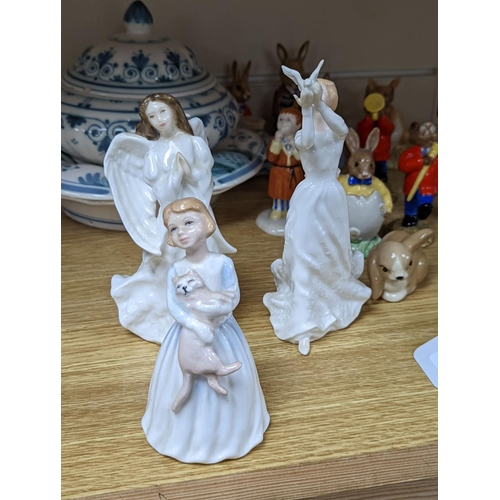 483 - A collection of Royal Doulton figures including Bunnykins, a Doulton vase and other items... 