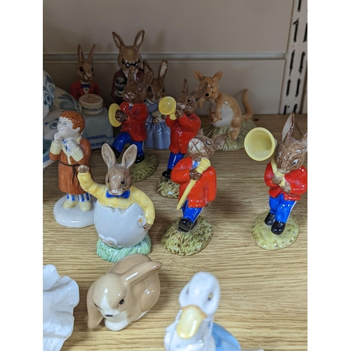 483 - A collection of Royal Doulton figures including Bunnykins, a Doulton vase and other items... 