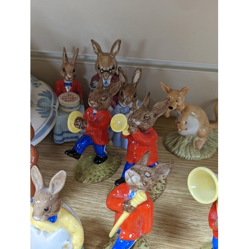 483 - A collection of Royal Doulton figures including Bunnykins, a Doulton vase and other items... 