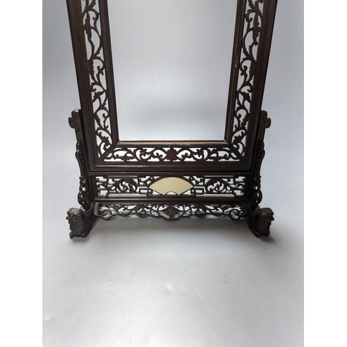 485 - A Chinese hardwood carved table screen, frame and stand, 30 cms high.