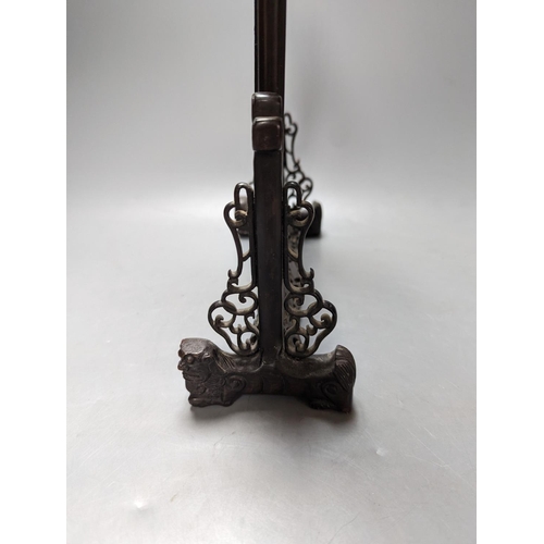 485 - A Chinese hardwood carved table screen, frame and stand, 30 cms high.