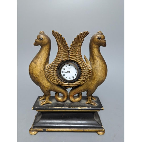 487 - A carved and gilt watch stand, 22 cms high.