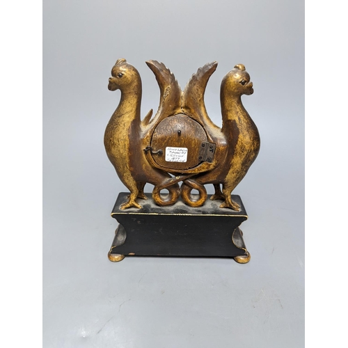 487 - A carved and gilt watch stand, 22 cms high.