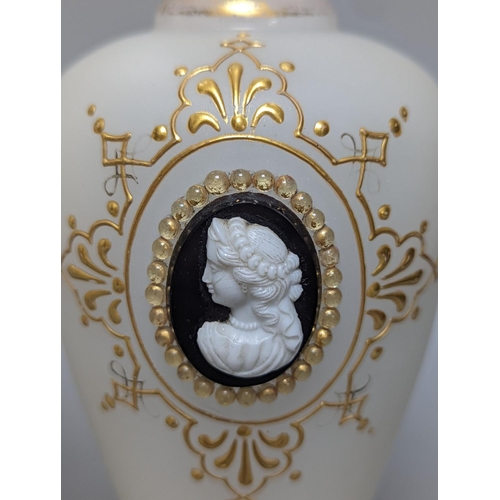 488 - Two cameo and gilt decorated vases, 23 cms high.