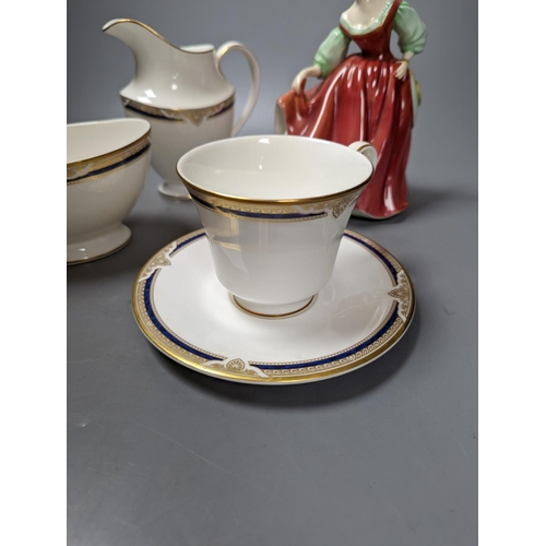 491 - A Royal Doulton figure 'St Ellen' and a Royal Doulton St Helier teaset, figure 19 cms high.... 