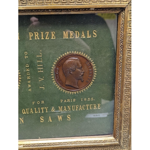 497 - Two Exhibition Prize Medals, to JV Hill, saw manufacturers, London 1851 and Paris 1855, frame 34cm. ... 