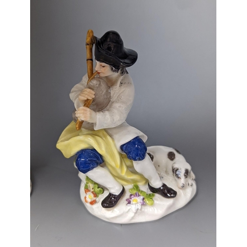 498 - A Meissen figure of a seated man playing the bagpipes, 8.5cm., and a similar group  of a huntswoman ... 