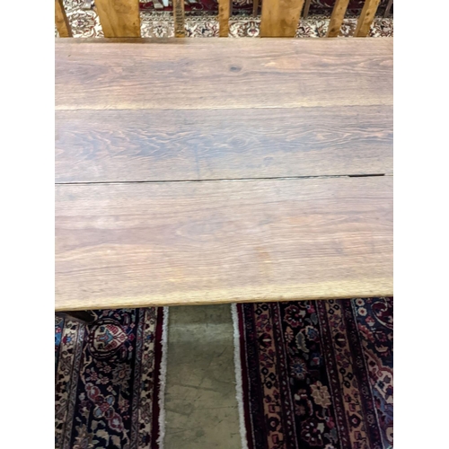 5 - A 19th century French rectangular oak kitchen table. W-153cm, D-75cm, H-73cm.