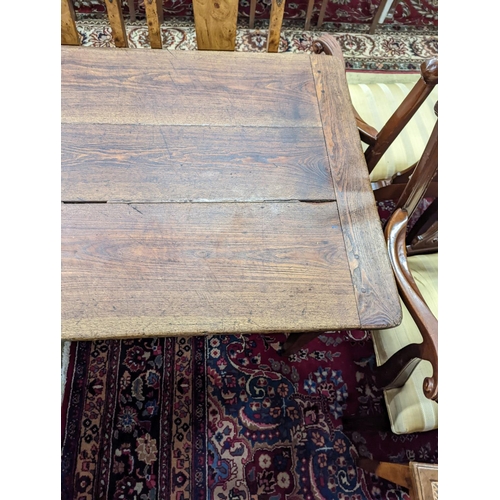 5 - A 19th century French rectangular oak kitchen table. W-153cm, D-75cm, H-73cm.