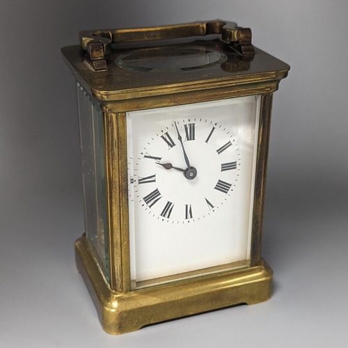 500 - A French brass carriage timepiece, 14cm. including handle