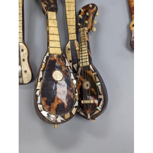 507 - Five 19th century tortoiseshell miniature stringed instruments, longest 20cm.