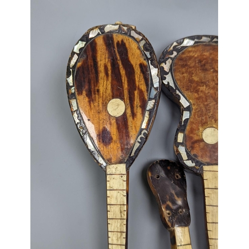 507 - Five 19th century tortoiseshell miniature stringed instruments, longest 20cm.