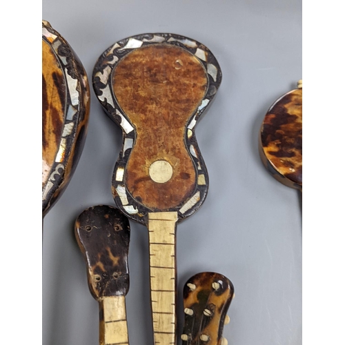 507 - Five 19th century tortoiseshell miniature stringed instruments, longest 20cm.