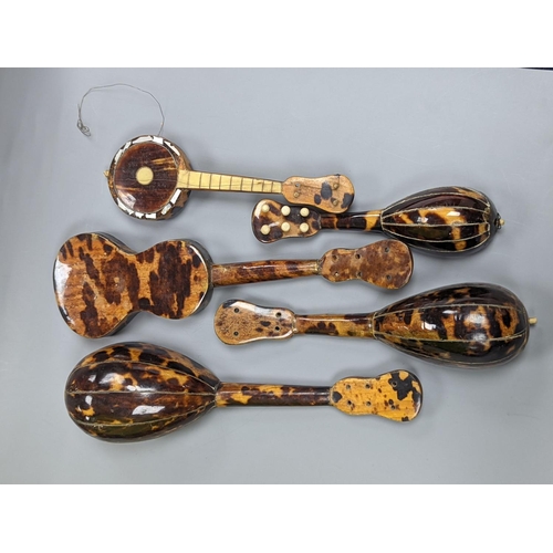 507 - Five 19th century tortoiseshell miniature stringed instruments, longest 20cm.