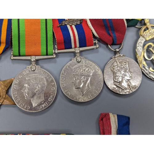 522 - A WWII medal group of six, with miniatures, and a royal commemorative medal, 1937