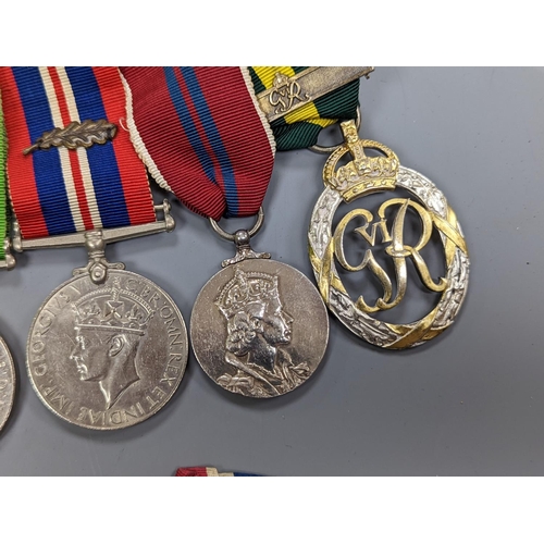 522 - A WWII medal group of six, with miniatures, and a royal commemorative medal, 1937