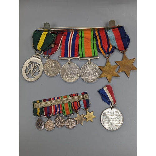 522 - A WWII medal group of six, with miniatures, and a royal commemorative medal, 1937