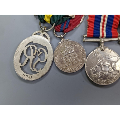 522 - A WWII medal group of six, with miniatures, and a royal commemorative medal, 1937