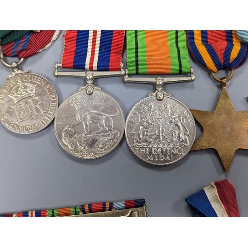 522 - A WWII medal group of six, with miniatures, and a royal commemorative medal, 1937