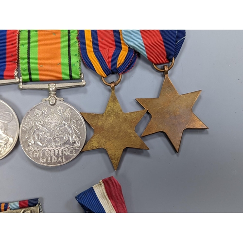 522 - A WWII medal group of six, with miniatures, and a royal commemorative medal, 1937