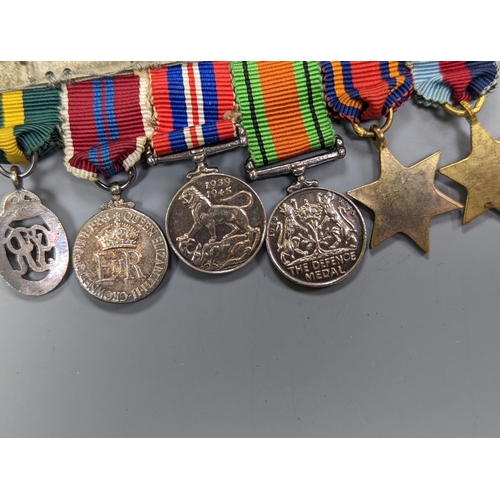 522 - A WWII medal group of six, with miniatures, and a royal commemorative medal, 1937