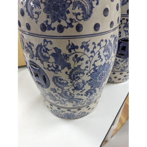 546 - A pair of Chinese blue and white garden seats, 44 cms high.