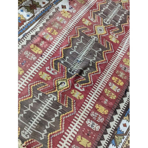 57 - A Kilim polychrome flatweave runner, 380 x 118cm (holed)