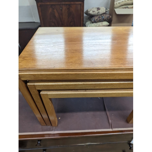 62 - A nest of three Gordon Russell 1960's rectangular teak tea tables, width 68cm, depth 45cm, height 46... 