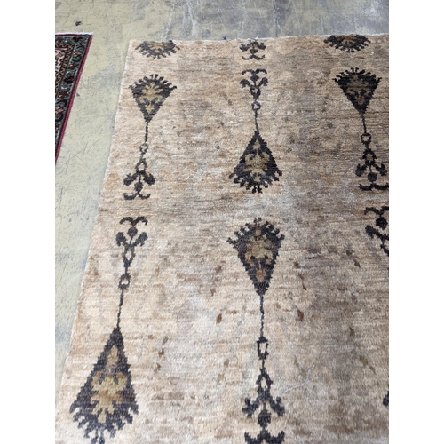 66 - A contemporary Ikat design Jute carpet, 300 x 240cm