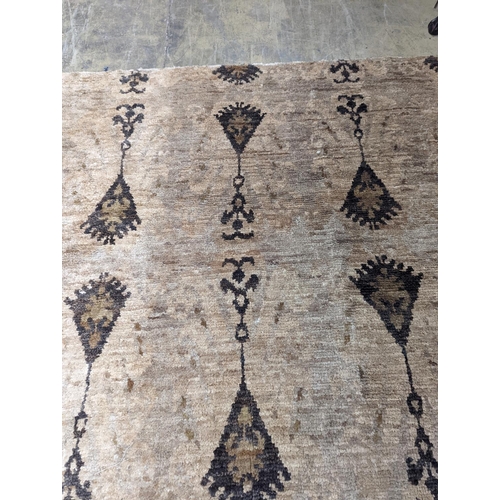 66 - A contemporary Ikat design Jute carpet, 300 x 240cm