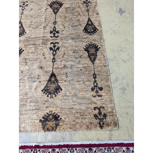 66 - A contemporary Ikat design Jute carpet, 300 x 240cm