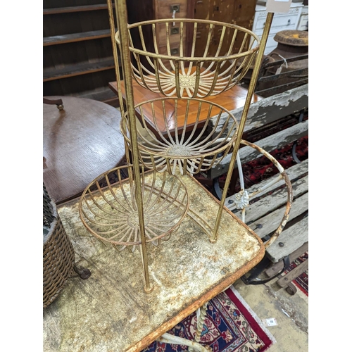 68 - A rattan and wirework stick stand, height 63cm, together with one other folding stand