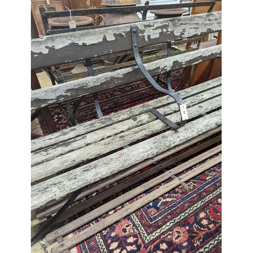 71 - A 19th century wrought iron slatted garden bench with footrest, bench length 182cm, depth 45cm, heig... 