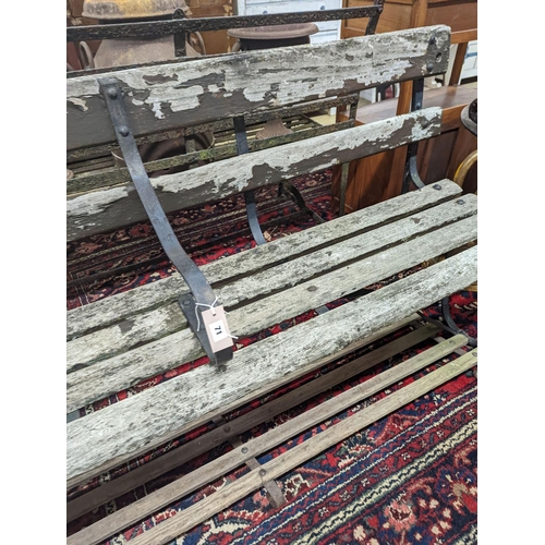 71 - A 19th century wrought iron slatted garden bench with footrest, bench length 182cm, depth 45cm, heig... 