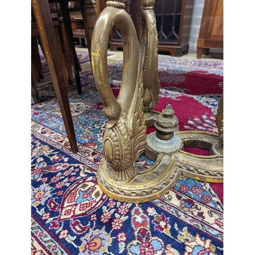 73 - A pair of Empire style circular glass top gilt composition ‘swan’ occasional tables. D-69cm, H-55cm.... 