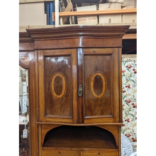 77 - An Edwardian satinwood banded mahogany compactum wardrobe, length 136cm, depth 56cm, height 210cm... 