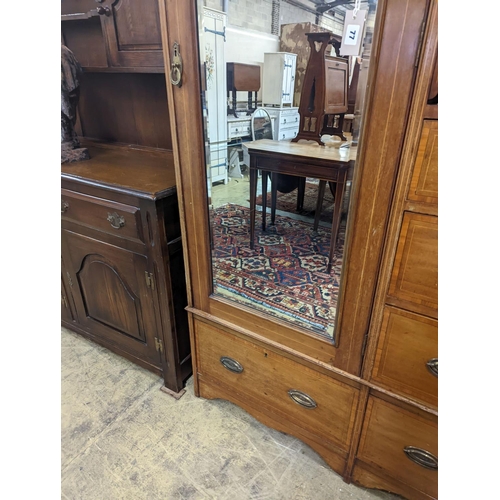 77 - An Edwardian satinwood banded mahogany compactum wardrobe, length 136cm, depth 56cm, height 210cm... 