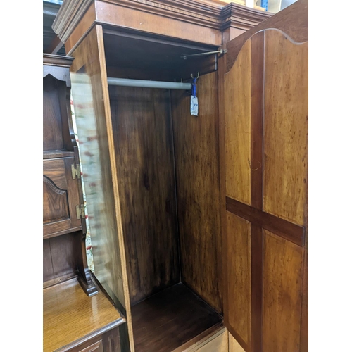 77 - An Edwardian satinwood banded mahogany compactum wardrobe, length 136cm, depth 56cm, height 210cm... 