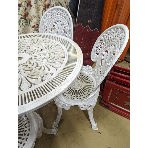 78 - A Victorian style painted aluminium circular garden table, diameter 80cm, height 70cm and four chair... 