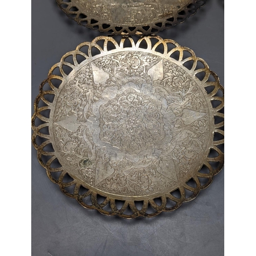 803 - A set of six Persian white metal circular shallow dishes, with pierced borders, 16.3cm, 972 grams.... 