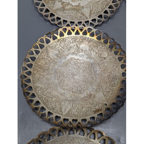 803 - A set of six Persian white metal circular shallow dishes, with pierced borders, 16.3cm, 972 grams.... 